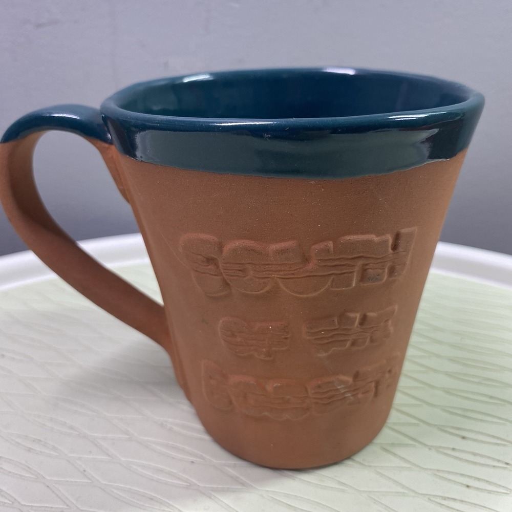 South of the border Meramec Caverns Jesse James Terra- Cotta&Teal Green Mug